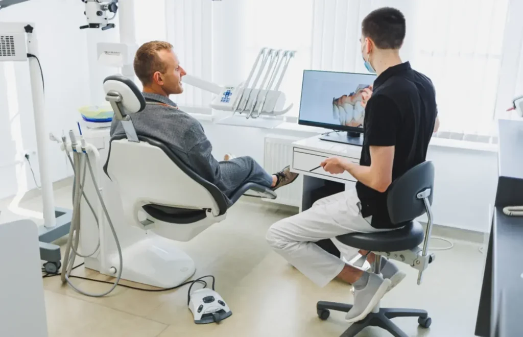 Modern dental office for rent featuring advanced dental equipment, a patient consultation in progress, and a clean, professional setting.