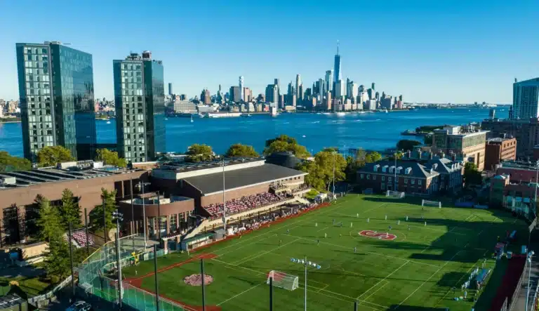 Aerial view of Stevens Institute of Technology soccer field in Hoboken, NJ, with Manhattan skyline and Hudson River in the background in Hoboken, NJ