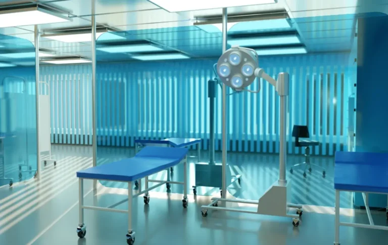 Modern medical coworking space equipped with examination beds and surgical lighting in a sleek, sterile environment.